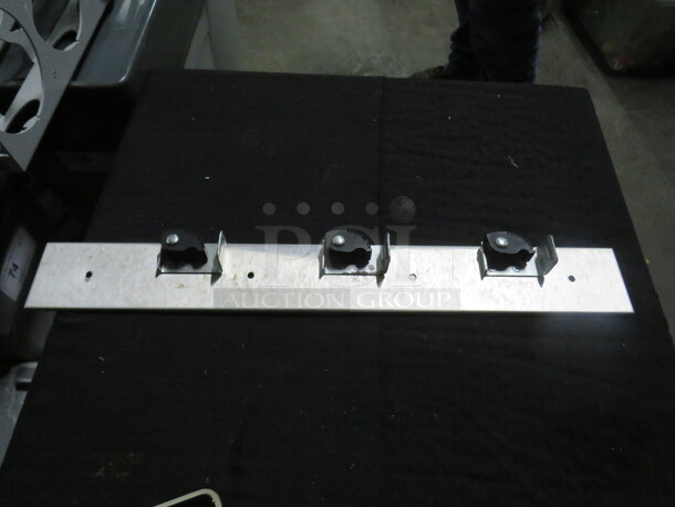 One Wall Mount Mop/Broom Holder. - Image 1 of 1