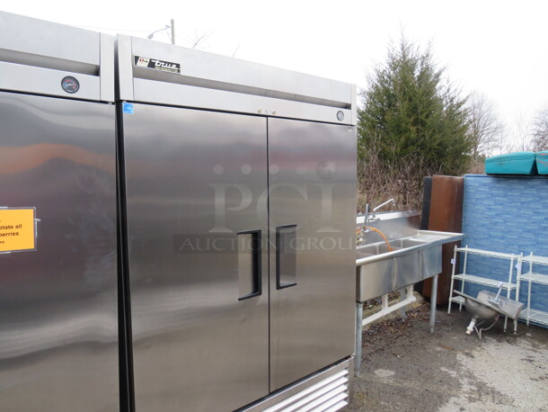 One WORKING Stainless Steel True 2 Door Refrigerator With 6 Racks On Casters. Model# T-49. 115 Volt. 49X30X82