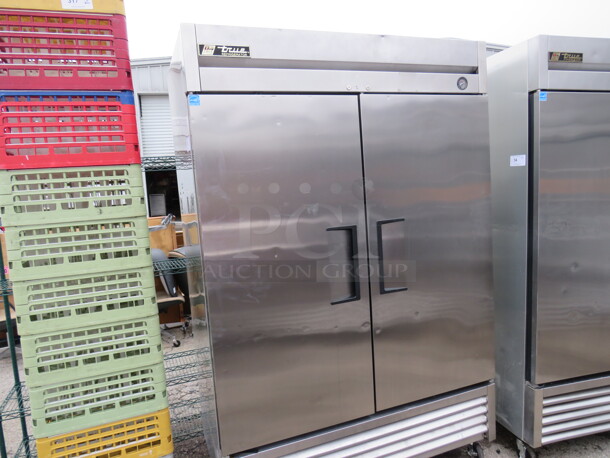 One WORKING Stainless Steel True 2 Door Refrigerator With 6 Racks On Casters. Model# T-49. 115 Volt. 49X30X82