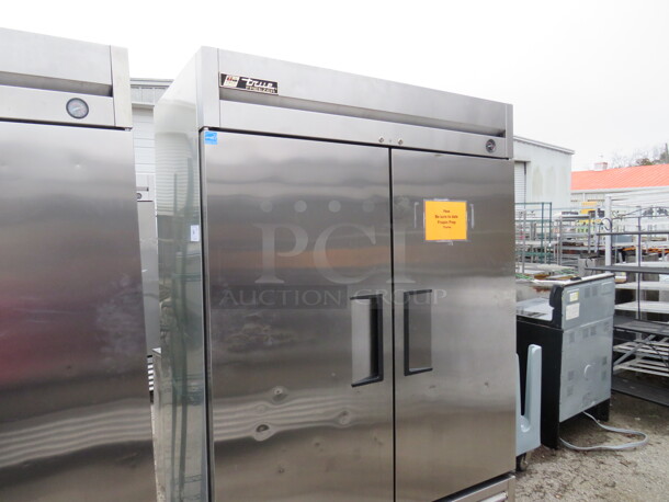 One WORKING Stainless Steel True 2 Door Freezer With 6 Racks On Casters. Model# T-49F. 115 Volt. 49X30X82