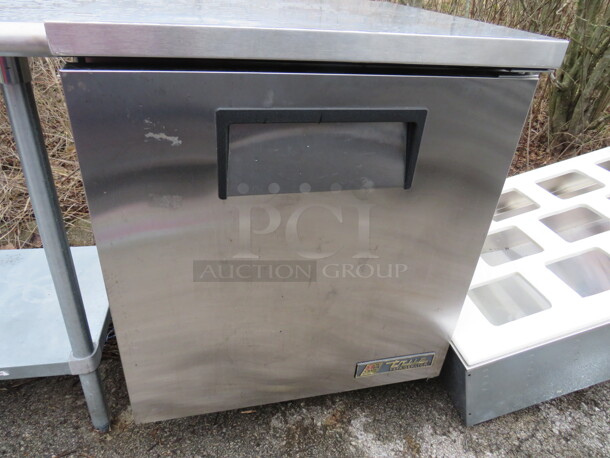 One WORKING True 1 Door Under Counter Refrigerator With 2 Racks On Casters. 115 Volt. Model# TUC-27. 27.5X30X36. $2493.16.