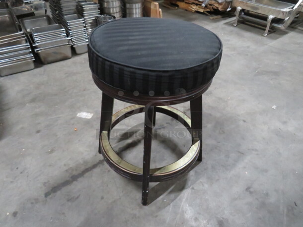 One Wooden Counter Height Bar Stool With Black Cushioned Swivel Seat And Footrest. - Image 1 of 1