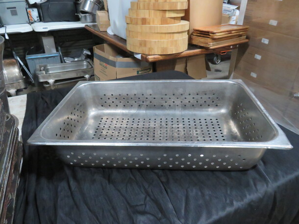 One Full Size 4 Inch Perforated Hotel Pan. 