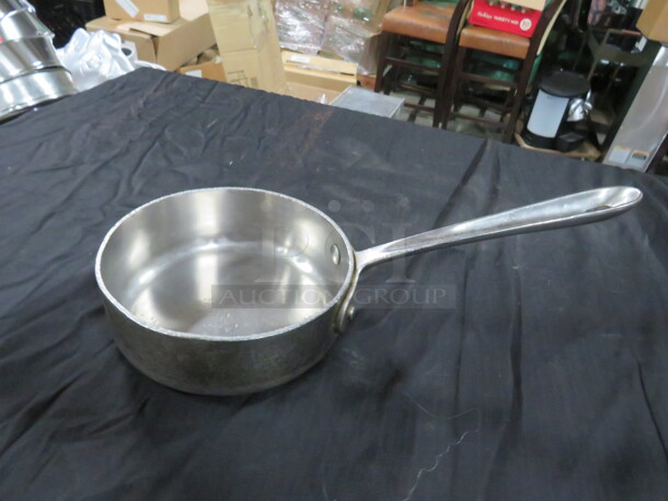 One 6 Inch All Clad Stainless Steel Sauc Pot.