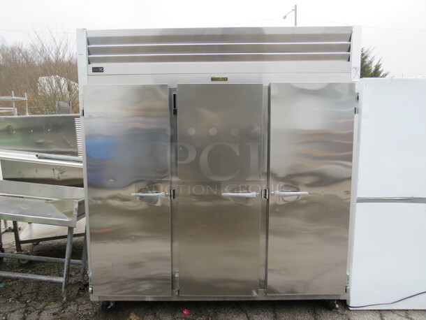 One Stainless Steel Traulsen 3 Door Refrigerator With Racks on Casters. 115 Volt. Model# G30011. 77X35X83.5. $9175.68 - Image 1 of 5