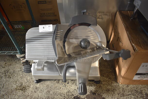 BRAND NEW! Hobart Centerline EDGE12-11 Stainless Steel Commercial Countertop 12" Manual Meat Slicer w/ Blade Sharpener. Missing Back Knob. 115 Volts, 1 Phase. 26x22x22. Tested and Working! - Image 1 of 7
