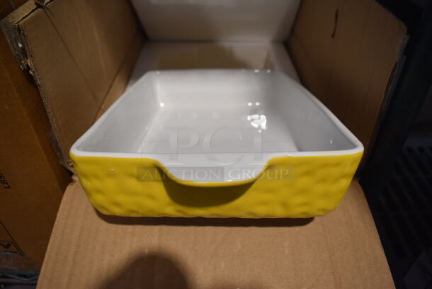 Box of BRAND NEW! Nutrichef NCCREX62 Set of 3 Yellow and White Ceramic Casserole Dishes. Includes 14.5x8.5x2.5