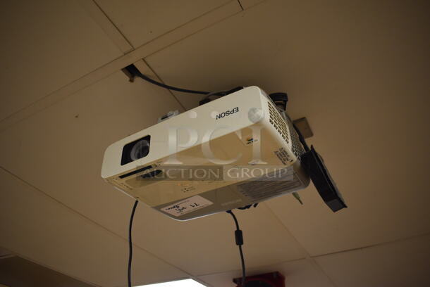 Epson Ceiling Mounted Projector and Pull Down Projection Screen. Stock Picture Used. BUYER MUST REMOVE. 11x8x4, 94