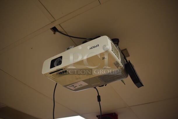 Epson Ceiling Mounted Projector and Pull Down Projection Screen. Stock Picture Used. BUYER MUST REMOVE. 11x8x4, 94". (EMT/Forensics Lab) - Image 1 of 2