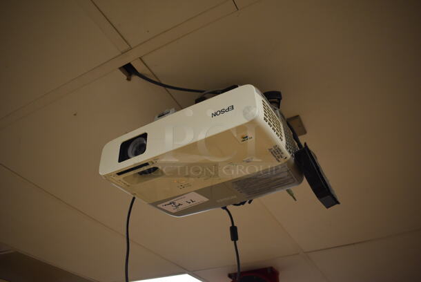 Epson Ceiling Mounted Projector and Pull Down Projection Screen. BUYER MUST REMOVE. 11x8x4, 94". (Pastry Kitchen) - Image 1 of 5