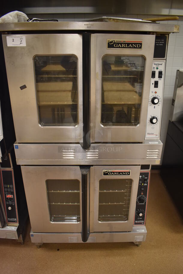 2 Garland Master 200 Stainless Steel Commercial Natural Gas Powered Full Size Convection Ovens w/ View Through Doors, Metal Oven Racks and Thermostatic Controls. BUYER MUST REMOVE. 38x42x71.5. 2 Times Your Bid! Tested and Working! (Pastry Kitchen)