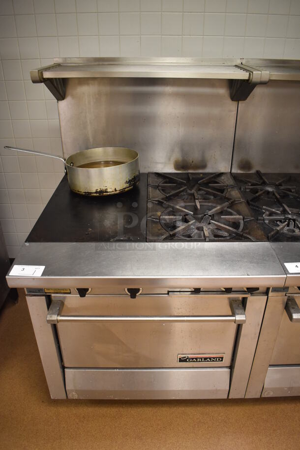 Garland M42-6R Stainless Steel Commercial Floor Style Natural Gas Powered 2 Burner Range w/ Flat Top, Oven, Over Shelf and Back Splash. BUYER MUST REMOVE. 34x38x58. Tested and Working! (Pastry Kitchen)