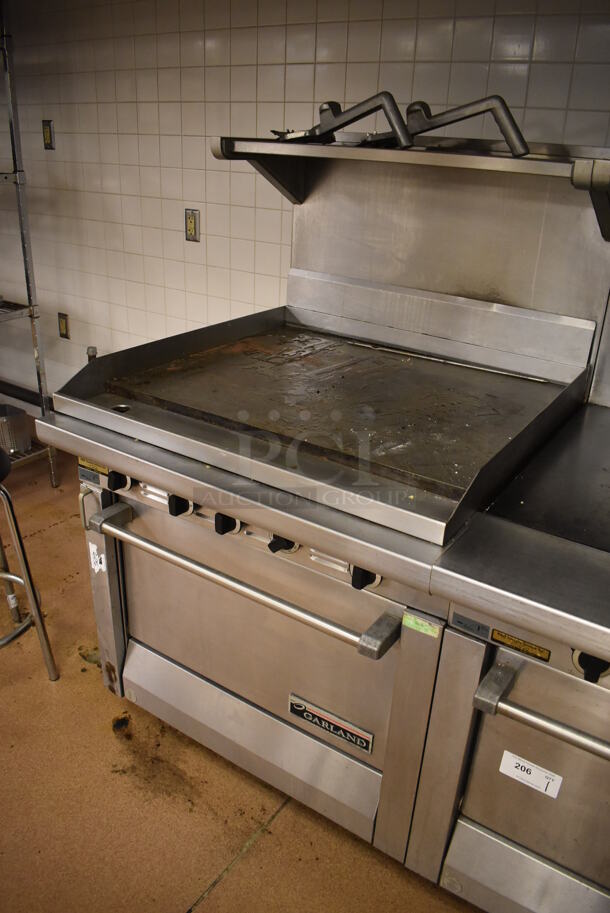 Garland M47R Stainless Steel Commercial Floor Style Natural Gas Powered Flat Top w/ Oven, Over Shelf and Back Splash. BUYER MUST REMOVE. 34x38x58. (Education Kitchen 2) - Image 3 of 7