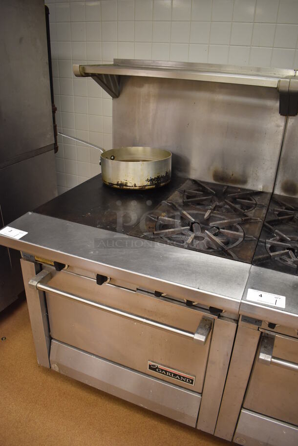 Garland M42-6R Stainless Steel Commercial Floor Style Natural Gas Powered 2 Burner Range w/ Flat Top, Oven, Over Shelf and Back Splash. BUYER MUST REMOVE. 34x38x58. Tested and Working! (Pastry Kitchen) - Image 2 of 8