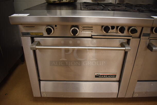 Garland M42-6R Stainless Steel Commercial Floor Style Natural Gas Powered 2 Burner Range w/ Flat Top, Oven, Over Shelf and Back Splash. BUYER MUST REMOVE. 34x38x58. Tested and Working! (Pastry Kitchen) - Image 4 of 8