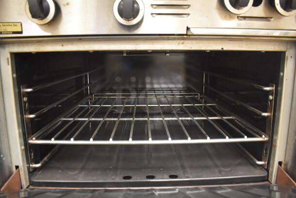 Garland M42-6R Stainless Steel Commercial Floor Style Natural Gas Powered 2 Burner Range w/ Flat Top, Oven, Over Shelf and Back Splash. BUYER MUST REMOVE. 34x38x58. Tested and Working! (Pastry Kitchen) - Image 5 of 8