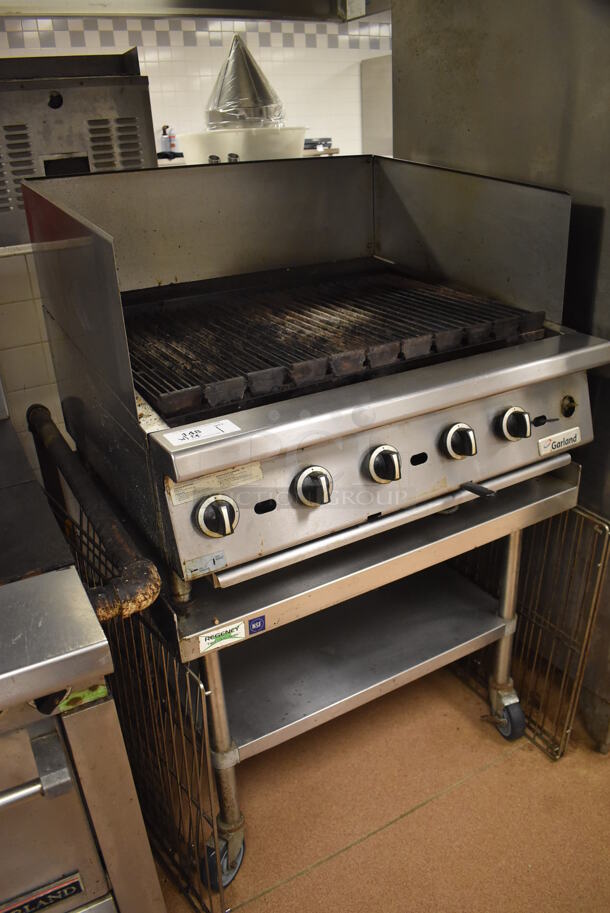 LATE MODEL! Garland Stainless Steel Commercial Countertop Gas Powered Charbroiler Grill w/ Side Splash Guards on Regency Stainless Steel Equipment Stand on Commercial Casters. BUYER MUST REMOVE. 35.5x32x26, 36x30x30. Tested and Working! (Restaurant Kitchen) - Image 5 of 6