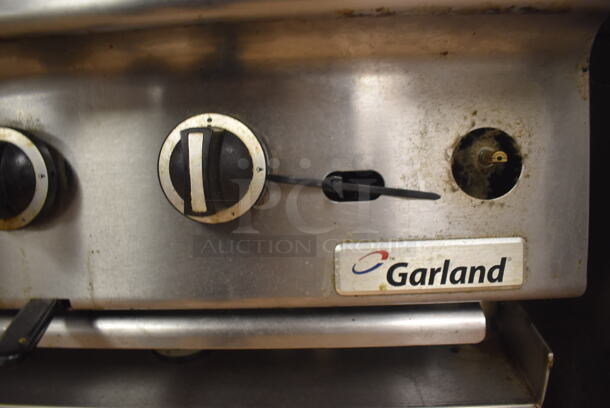 LATE MODEL! Garland Stainless Steel Commercial Countertop Gas Powered Charbroiler Grill w/ Side Splash Guards on Regency Stainless Steel Equipment Stand on Commercial Casters. BUYER MUST REMOVE. 35.5x32x26, 36x30x30. Tested and Working! (Restaurant Kitchen) - Image 6 of 6