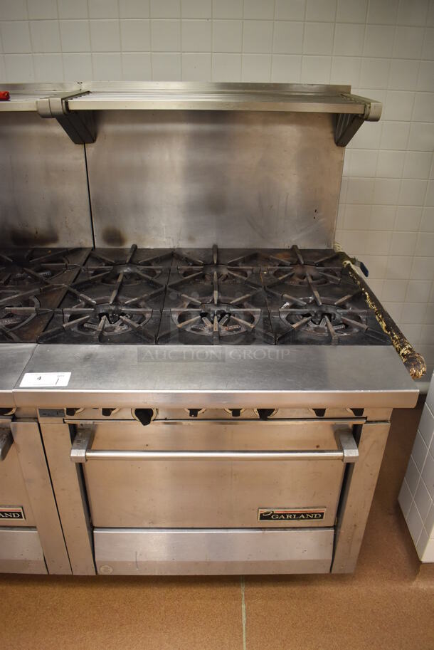 Garland M43R Stainless Steel Commercial Floor Style Natural Gas Powered 2 Burner Range w/ Flat Top, Oven, Over Shelf and Back Splash. BUYER MUST REMOVE. 34x38x58. Tested and Working! (Pastry Kitchen) - Image 1 of 8