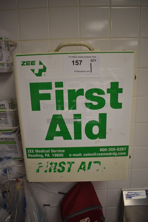 White Metal Wall Mount First Aid Kit. BUYER MUST REMOVE. 14x7.5x17. (Restaurant Kitchen)