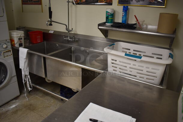 Stainless Steel Commercial 2 Bay Sink w/ Dual Drain Boards, Faucet, Handles and Spray Nozzle Attachment. BUYER MUST REMOVE. 121x30x45. Bays 24x24x14. Drain Board 33x26x1. (Store Room)