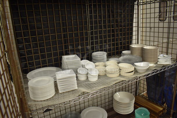 Chrome Finish 3 Tier Wire Shelving Unit w/ Liquor Cage on Commercial Casters. Comes w/ Contents Including Plates, Serving Trays and Metal Baskets. BUYER MUST DISMANTLE. PCI CANNOT DISMANTLE FOR SHIPPING. PLEASE CONSIDER FREIGHT CHARGES. 62x27x68. (Restaurant Kitchen) - Image 3 of 6