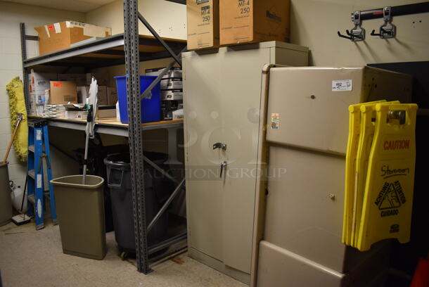 ALL ONE MONEY! Wall Lot of Gray Metal Shelving Unit w/ Contents and Tan Filing Cabinet. BUYER MUST REMOVE. Includes 102x36x96. (Maintenance Room)