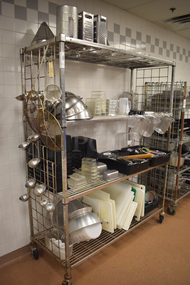 Metal 4 Tier Wire Shelving Unit w/ Contents Including Utensils, Poly Drop In Bins and Cutting Boards on Commercial Casters. BUYER MUST DISMANTLE. PCI CANNOT DISMANTLE FOR SHIPPING. PLEASE CONSIDER FREIGHT CHARGES. 60x24x78. (Restaurant Kitchen) - Image 1 of 10