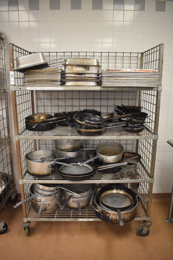 Metal 4 Tier Wire Shelving Unit w/ Contents Including Metal Baking Pans, Drop In Bins and Skillets on Commercial Casters. BUYER MUST DISMANTLE. PCI CANNOT DISMANTLE FOR SHIPPING. PLEASE CONSIDER FREIGHT CHARGES. 48x24x70. (Restaurant Kitchen) - Image 2 of 11