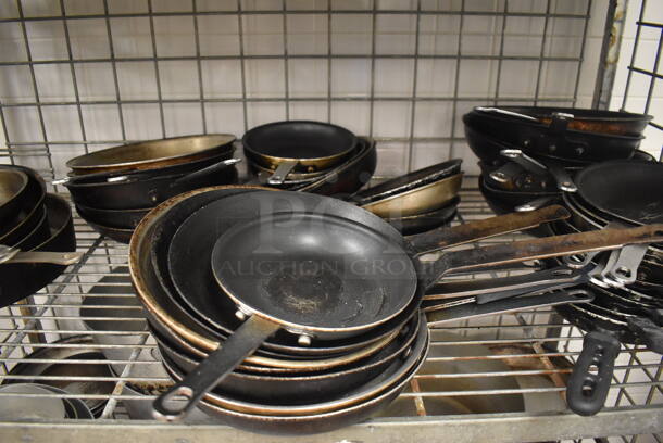 Metal 4 Tier Wire Shelving Unit w/ Contents Including Metal Baking Pans, Drop In Bins and Skillets on Commercial Casters. BUYER MUST DISMANTLE. PCI CANNOT DISMANTLE FOR SHIPPING. PLEASE CONSIDER FREIGHT CHARGES. 48x24x70. (Restaurant Kitchen) - Image 6 of 11