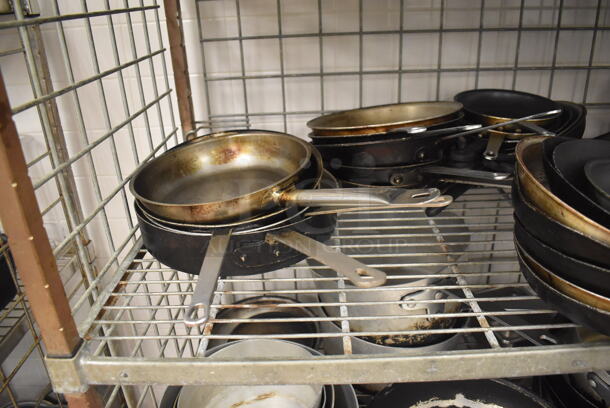 Metal 4 Tier Wire Shelving Unit w/ Contents Including Metal Baking Pans, Drop In Bins and Skillets on Commercial Casters. BUYER MUST DISMANTLE. PCI CANNOT DISMANTLE FOR SHIPPING. PLEASE CONSIDER FREIGHT CHARGES. 48x24x70. (Restaurant Kitchen) - Image 7 of 11