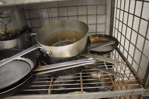Metal 4 Tier Wire Shelving Unit w/ Contents Including Metal Baking Pans, Drop In Bins and Skillets on Commercial Casters. BUYER MUST DISMANTLE. PCI CANNOT DISMANTLE FOR SHIPPING. PLEASE CONSIDER FREIGHT CHARGES. 48x24x70. (Restaurant Kitchen) - Image 9 of 11