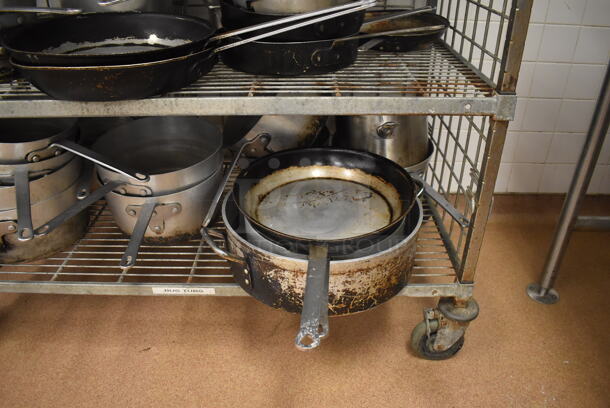 Metal 4 Tier Wire Shelving Unit w/ Contents Including Metal Baking Pans, Drop In Bins and Skillets on Commercial Casters. BUYER MUST DISMANTLE. PCI CANNOT DISMANTLE FOR SHIPPING. PLEASE CONSIDER FREIGHT CHARGES. 48x24x70. (Restaurant Kitchen) - Image 10 of 11