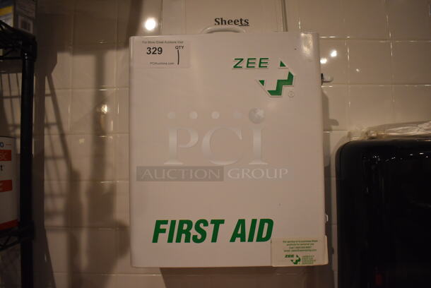 White Metal Wall Mount First Aid Kit. BUYER MUST REMOVE. 14x7.5x16.5. (Demo Kitchen)