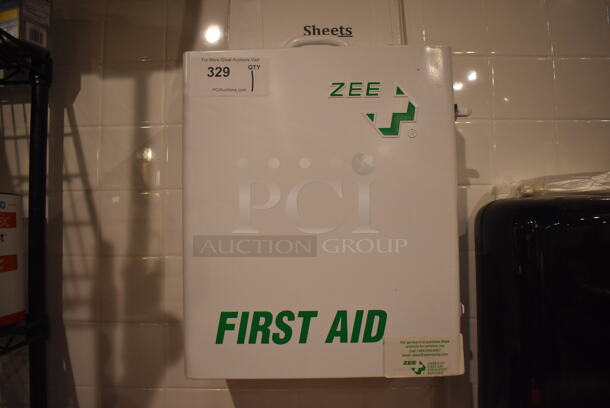 White Metal Wall Mount First Aid Kit. BUYER MUST REMOVE. 14x7.5x16.5. (Demo Kitchen) - Image 1 of 4
