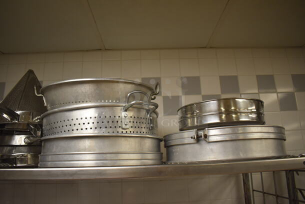 Metal 4 Tier Wire Shelving Unit on Commercial Casters w/ Contents Including Metal Bowls, Skillets and China Cap Strainers. BUYER MUST DISMANTLE. PCI CANNOT DISMANTLE FOR SHIPPING. PLEASE CONSIDER FREIGHT CHARGES. 60x24x78. (Education Kitchen 2) - Image 4 of 11
