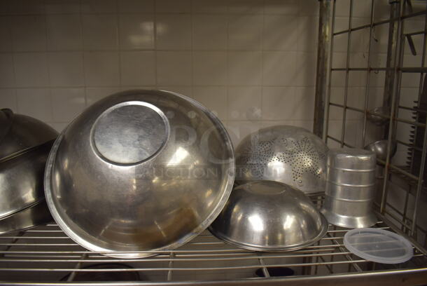 Metal 4 Tier Wire Shelving Unit on Commercial Casters w/ Contents Including Metal Bowls, Skillets and China Cap Strainers. BUYER MUST DISMANTLE. PCI CANNOT DISMANTLE FOR SHIPPING. PLEASE CONSIDER FREIGHT CHARGES. 60x24x78. (Education Kitchen 2) - Image 5 of 11