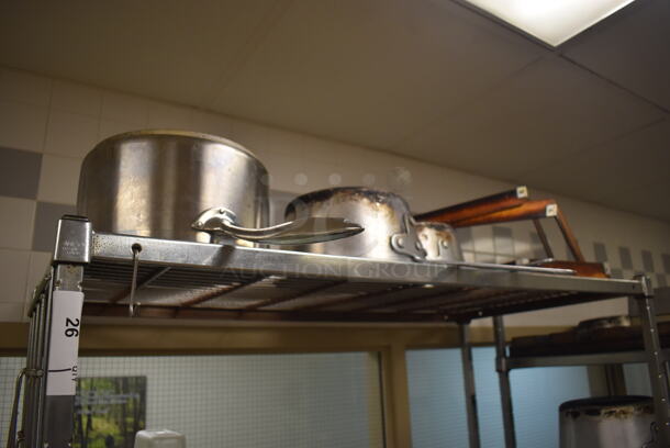 Metal 4 Tier Wire Shelving Unit w/ Contents Including Poly Drop In Bins, Utensils, Cutting Boards and Bundt Cake Pans. BUYER MUST DISMANTLE. PCI CANNOT DISMANTLE FOR SHIPPING. PLEASE CONSIDER FREIGHT CHARGES. 48x24x84. (Pastry Kitchen) - Image 2 of 7