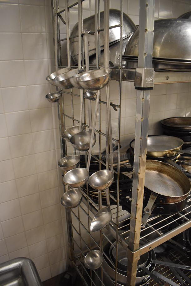 Metal 4 Tier Wire Shelving Unit on Commercial Casters w/ Contents Including Metal Bowls, Skillets and China Cap Strainers. BUYER MUST DISMANTLE. PCI CANNOT DISMANTLE FOR SHIPPING. PLEASE CONSIDER FREIGHT CHARGES. 60x24x78. (Education Kitchen 2) - Image 11 of 11