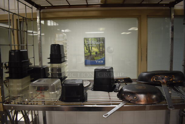 Metal 4 Tier Wire Shelving Unit w/ Contents Including Poly Drop In Bins, Utensils, Cutting Boards and Bundt Cake Pans. BUYER MUST DISMANTLE. PCI CANNOT DISMANTLE FOR SHIPPING. PLEASE CONSIDER FREIGHT CHARGES. 48x24x84. (Pastry Kitchen) - Image 3 of 7
