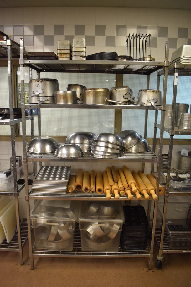 Metal 5 Tier Wire Shelving Unit w/ Contents Including Sauce Pots, Metal Bowls, Muffin Baking Pans, Rolling Pins and Metal Pans. BUYER MUST DISMANTLE. PCI CANNOT DISMANTLE FOR SHIPPING. PLEASE CONSIDER FREIGHT CHARGES. 48x24x84. (Pastry Kitchen)