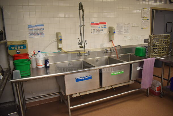 Stainless Steel Commercial 3 Bay Sink w/ Dual Drain Boards, 2 Faucets, 2 Handle Sets and Spray Nozzle Attachment. BUYER MUST REMOVE. 135x36x42. Bays 24x30x14. Drain Boards 28x32x1. (Pastry Kitchen) - Image 1 of 5