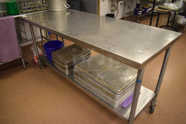 Stainless Steel Table w/ Under Shelf on Commercial Casters. Includes Half and Full Size Baking Pans. 72x30x36. (Pastry Kitchen)