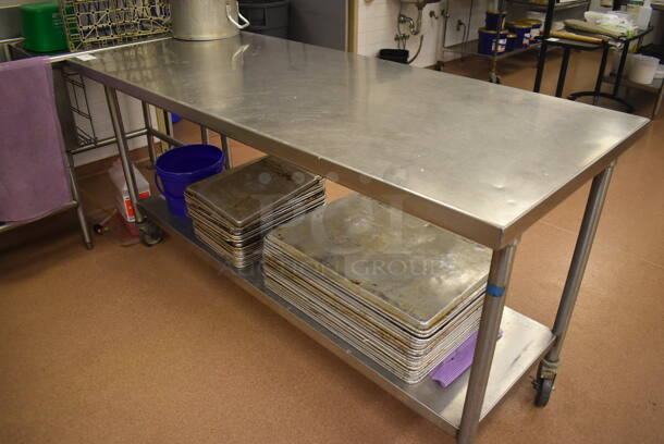Stainless Steel Table w/ Under Shelf on Commercial Casters. Includes Half and Full Size Baking Pans. 72x30x36. (Pastry Kitchen) - Image 1 of 5