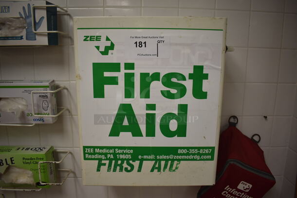 White Metal Wall Mount First Aid Kit. BUYER MUST REMOVE. 14x7.5x16.5. (Education Kitchen 2)