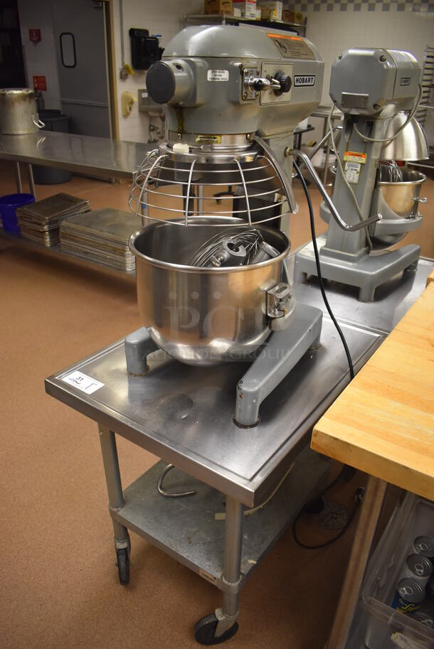 Hobart A200 Metal Commercial Countertop 20 Quart Planetary Dough Mixer w/ Stainless Steel Mixing Bowl, Bowl Guard, Whisk, Paddle, 2 Dough Hook and 2 Pastry Hook Attachments on Stainless Steel Commercial Equipment Stand w/ Under Shelf. 115 Volts, 1 Phase. 17x20x31, 24x30x29. Tested and Working! (Pastry Kitchen)