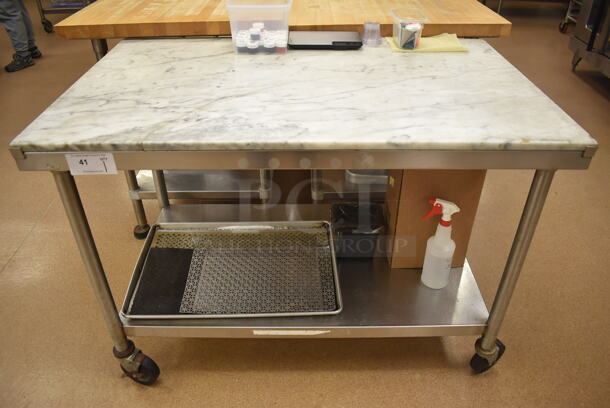 Stainless Steel Table w/ Marble Countertop and Stainless Steel Under Shelf on Commercial Casters. Does Not Include Contents. 48x30x35. (Pastry Kitchen)