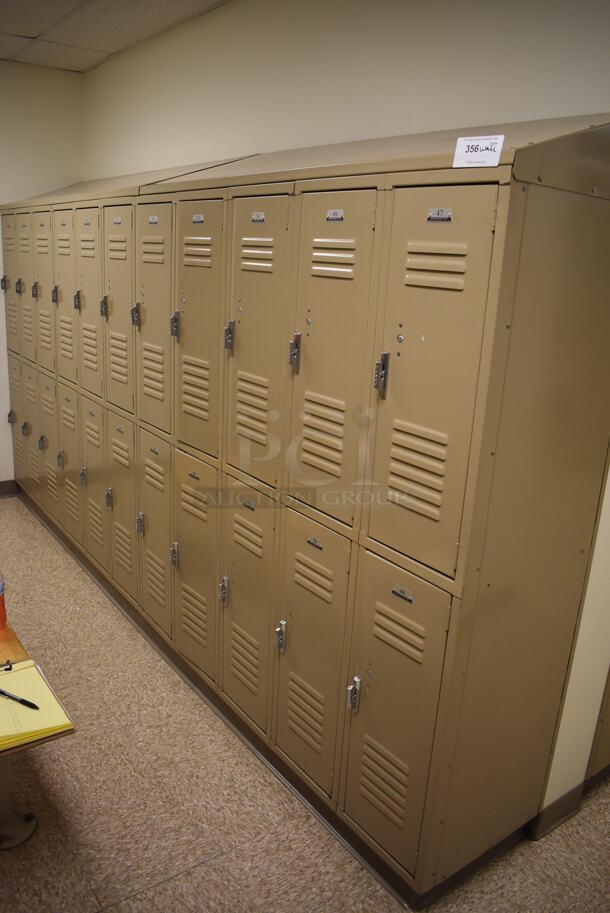 Wall of 22 Tan Metal Lockers. BUYER MUST REMOVE. 132x18x71. (Mens Locker Room)