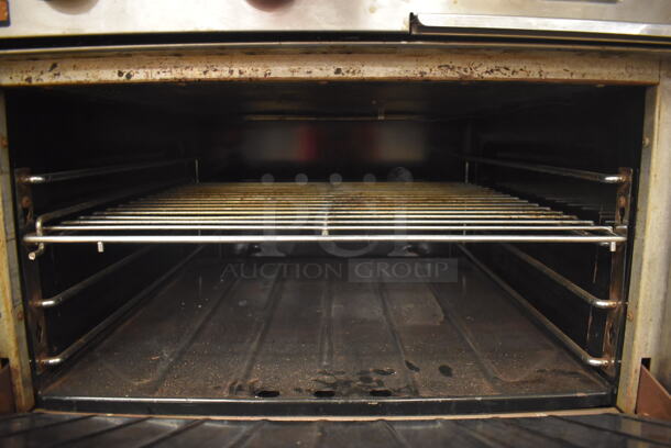 Garland M42-6R Stainless Steel Commercial Floor Style Natural Gas Powered 2 Burner Range w/ Flat Top, Oven, Over Shelf and Back Splash. BUYER MUST REMOVE. 34x38x58. Tested and Working! (Education Kitchen 2) - Image 6 of 8