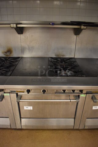 Garland M42-6R Stainless Steel Commercial Floor Style Natural Gas Powered 2 Burner Range w/ Flat Top, Oven, Over Shelf and Back Splash. BUYER MUST REMOVE. 34x38x58. Tested and Working! (Education Kitchen 2)